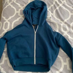 blue cropped zip up